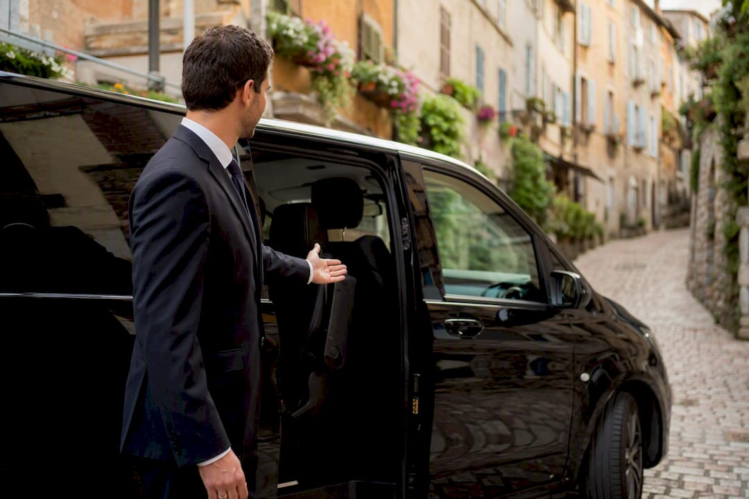 Mercedes-Benz van with chauffeur at Grasse historic centre for luxury transfer