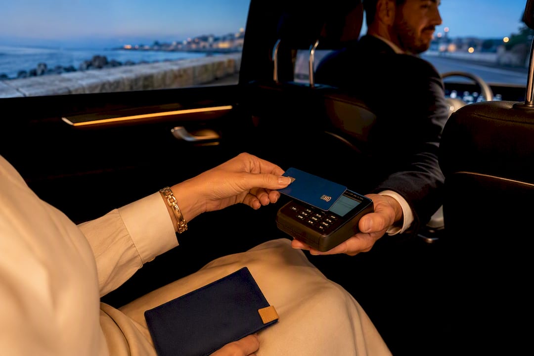 Mercedes-Benz sedan accepting card payment during a private chauffeur transfer in Antibes, French Riviera