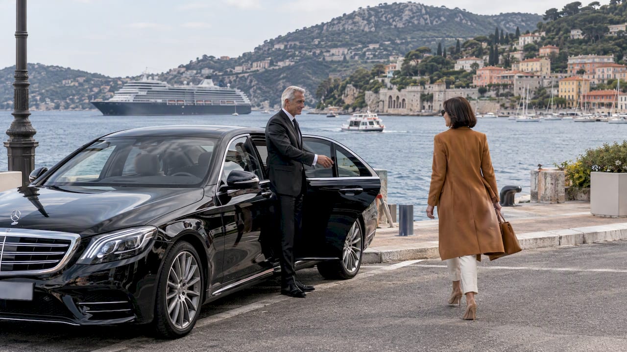 Private chauffeur Mercedes sedan arriving at Villefranche port for a Riviera cruise transfer.